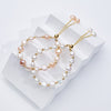 Carina – Pendientes de oro con perlas móviles.