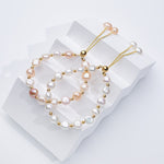 Carina – Pendientes de oro con perlas móviles.