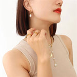 Greta-Marie – Pendientes de oro con perlas colgantes.
