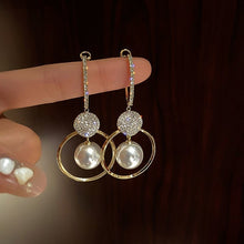 Karolína - Golden earrings with clear teardrop shape.