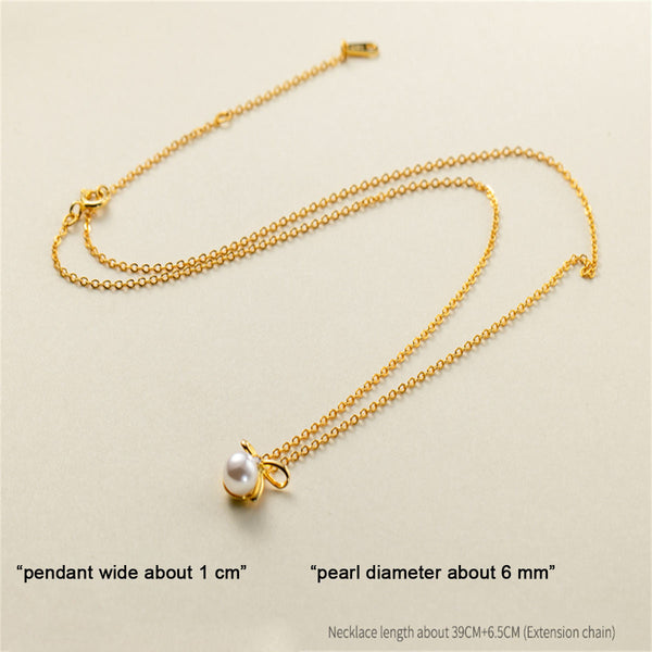 Johana-Luisa – Pendientes de oro con perla doble.