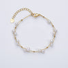 Marlena – Pulsera dorada con acentos de perlas.