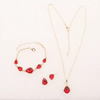 Selma – Ruby set with gold accents.
