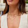 Tanja - Layered gold necklace with modern charm.