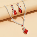 Ingrid – Conjunto con rubí y brillo dorado.