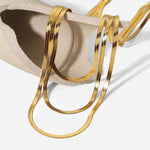Sofie – Collar de múltiples capas doradas finas.