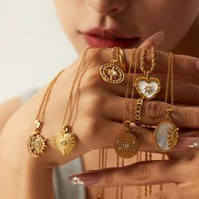 Alžběta - Gold necklace with small symbolic charms.