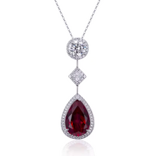 Pia – Colgante con rubí y delicado marco de cristal