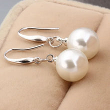 Olivia-Rosa – Pendientes de oro con perlas.