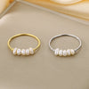Rosalie – Pendientes de gota dorados con perla.