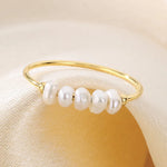 Rosalie – Pendientes de gota dorados con perla.