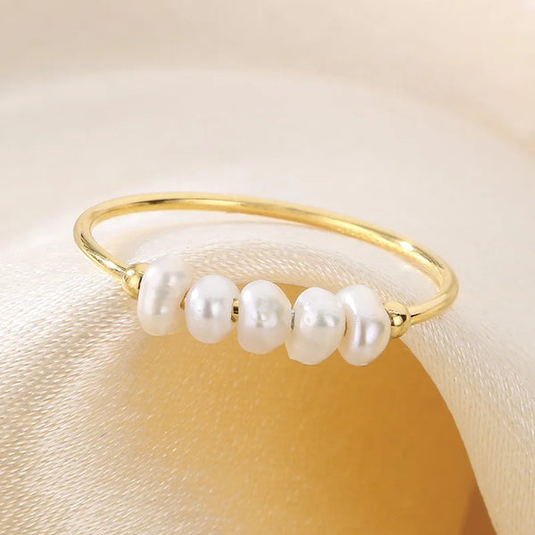 Rosalie – Pendientes de gota dorados con perla.