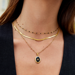 Elisa-Marie – Gently curved gold necklace.