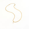 Eva – Collar dorado con colgante de inicial.