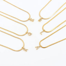 Eva – Gold necklace with initial pendant.