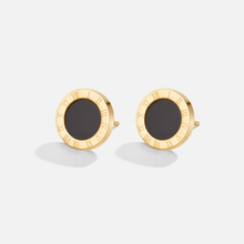 Selina – Aretes redondos con centro negro.