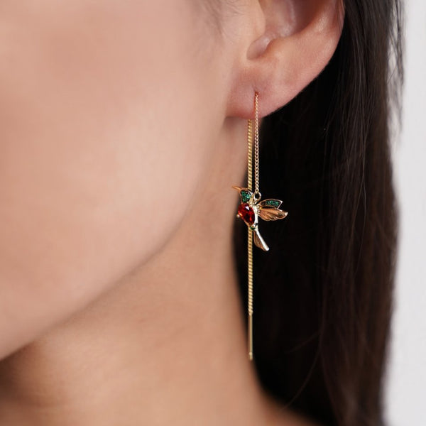 Gold hoops with delicate pendant