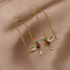 Anillos de oro con un delicado colgante