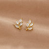 Felicita – Pendientes de oro con detalle de hojas.