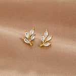 Felicita – Pendientes de oro con detalle de hojas.
