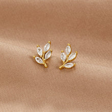 Felicita – Pendientes de oro con detalle de hojas.