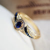 Beatrix – Anillo dorado con doble piedra.