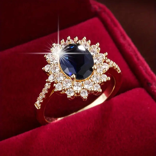 Karolína – Anillo dorado con zafiro floral.
