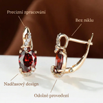 Karla – Pendientes dorados con brillo rubí.
