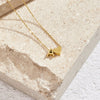 Nina – Collar dorado en forma de V.