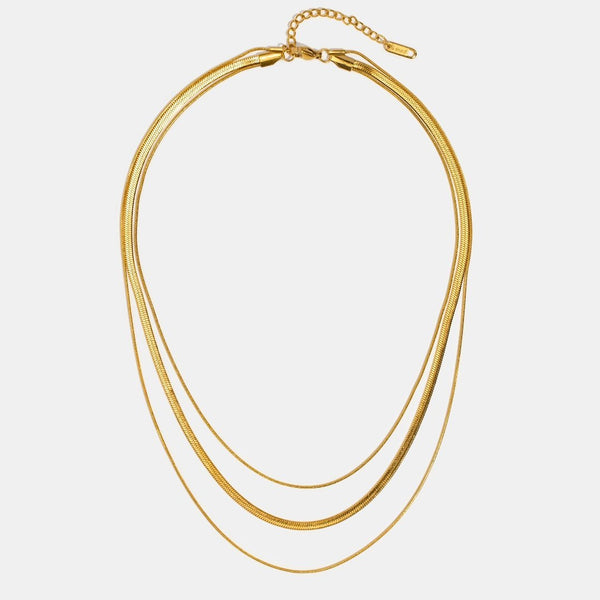 Antonie – Collar dorado de múltiples capas con una estructura clara.