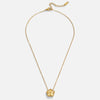 Isabela – Round gold necklace with a delicate pendant.