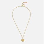 Ronja – Collar dorado con colgante floral.