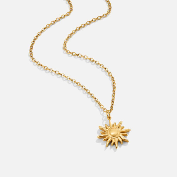 Ronja – Collar dorado con colgante floral.