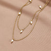 Tanja – Collar dorado de capas con un eslabón moderno.