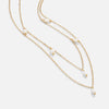 Tanja - Layered gold necklace with modern charm.