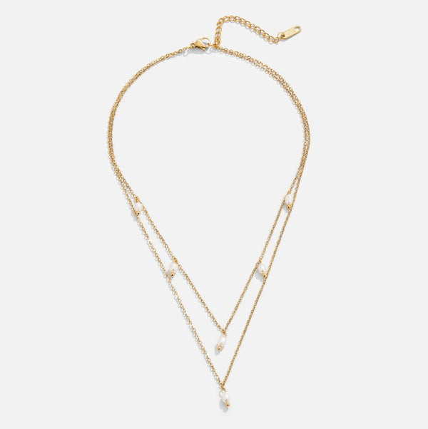 Tanja - Layered gold necklace with modern charm.