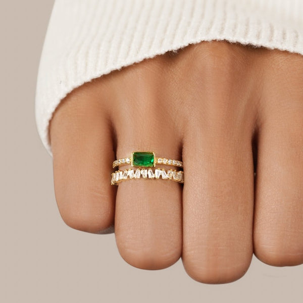 Sabina - Gold ring with emerald green accents.