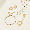 Helmina – Colorful gold chain with enamel accents.