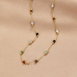 Helmina – Colorful gold chain with enamel accents.