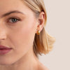 Frieda – Pendientes de oro con curvatura redonda.