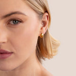 Frieda – Pendientes de oro con curvatura redonda.