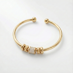 Nina - Pulsera dorada ajustable con charms