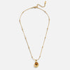 Leonie – Cadena con colgante redondo dorado.
