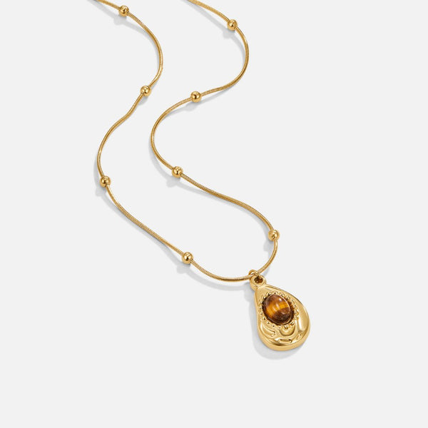 Leonie – Cadena con colgante redondo dorado.