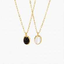 Veronika – Double gold necklace with black accents.