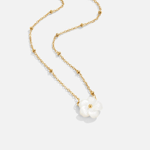 Alena – Collar dorado con colgante de flor.