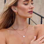 Jana – Collar doble con colgante redondo.