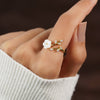 Miriam – Engagement ring with white floral embellishment.