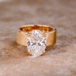 Lara - Round solitaire ring in a gold finish.